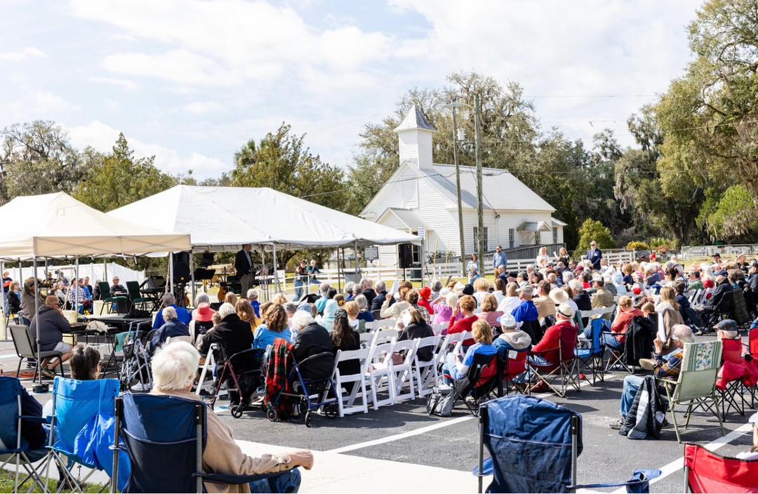 Families gathered for an outdoor service